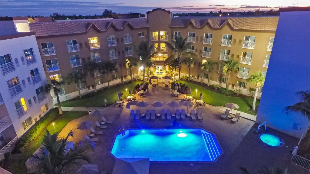 Enjoy our sunset view of the hotel pool area.