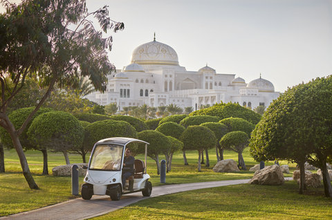 MOAUH Garden With Club Car And View Of Qasr Al Watan