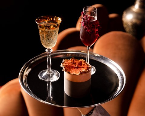 Pour over our exquisite cocktail menu, inspired by our iconic past