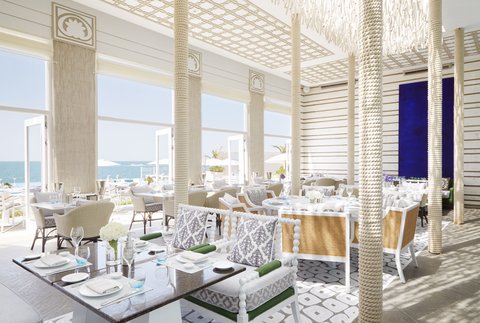 A chic pool and beachside restaurant overlooking the glittering Arabian Gulf.