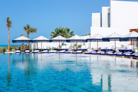 A chic pool and beachside restaurant overlooking the glittering Arabian Gulf.