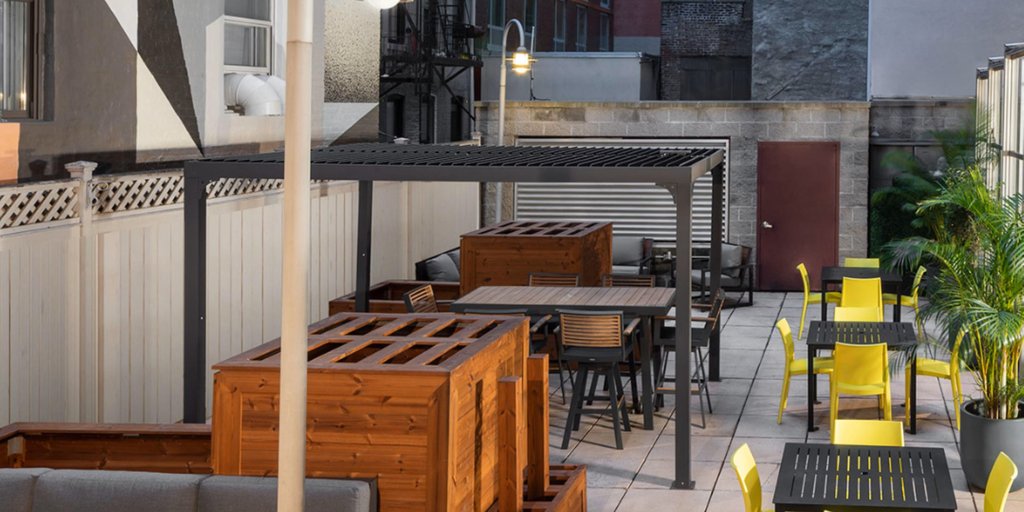 voco Times Square South New York by IHG - Soak up the sun while enjoying a meal on our balcony.