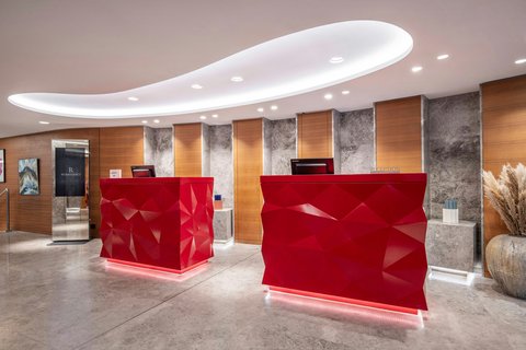 Hotel reception, red reception desks