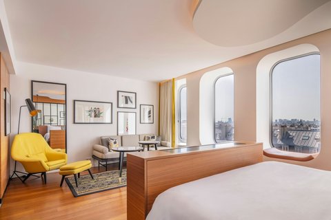 King-size bed, sofa, chair, XXL windows on Paris