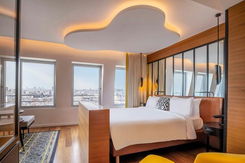 King size bed, large windows overlooking Paris