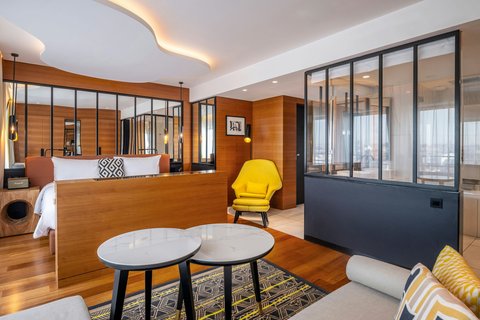 Sofa, table, chair, king size bed, bathroom