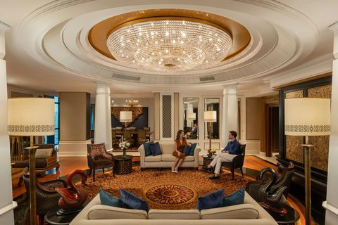 Couple Relaxing in Ratanakosin Suite Living Room