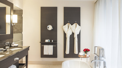 Spacious Bathroom with free standing bath tube in every suite