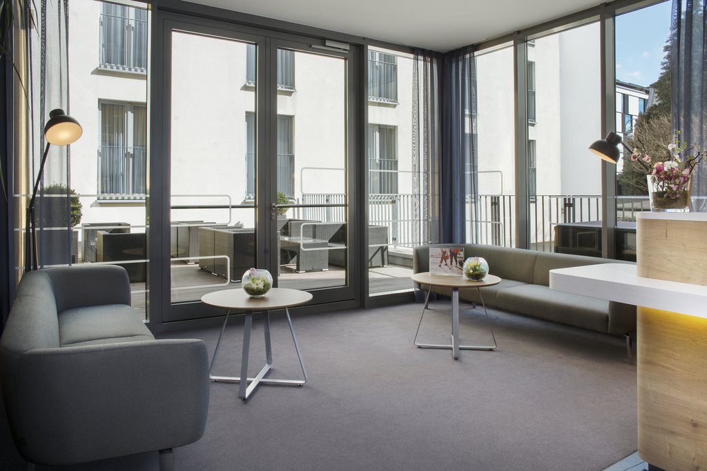 Ample seating in a light-filled, open-plan lobby area.