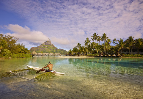 Traditional outrigger canoe in the coral garden