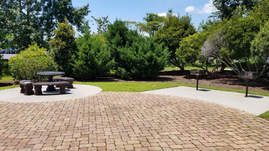 Our outdoor patio features two charcoal BBQ grills.