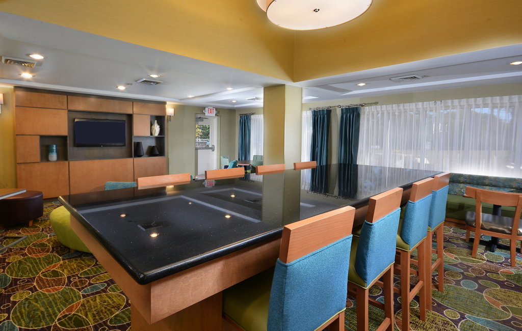 Relax with family in our hotel lobby before heading to the NC Zoo.