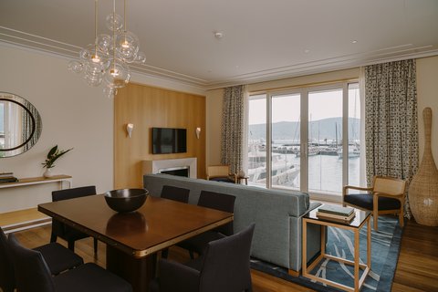 Relax by the fireplace and enjoy view of bay from our suites