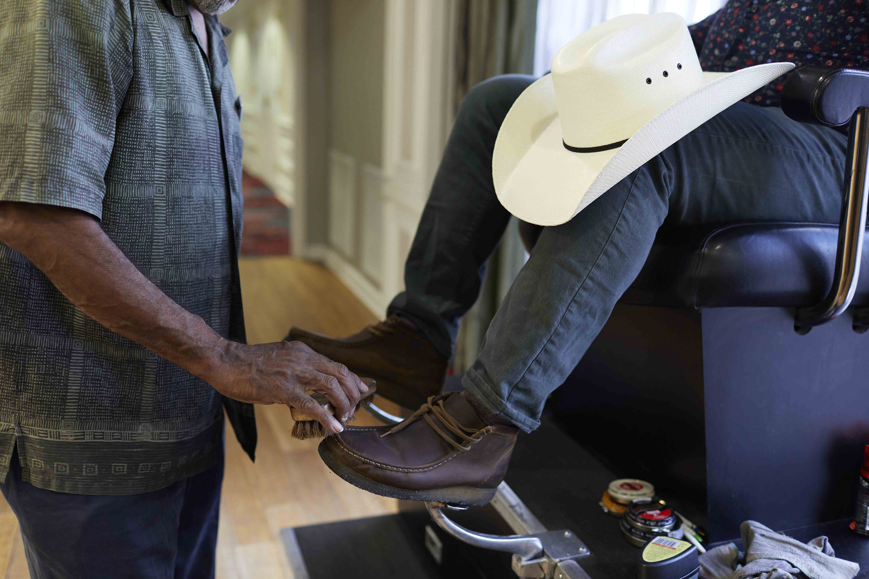 Sit in our vintage shoeshine chair for your complimentary service!
