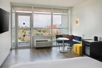 Breezy, Larger Guest room, 1 King, Balcony