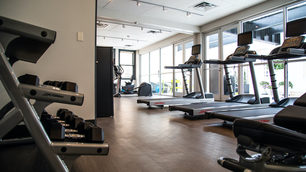 Fitness center with free weights, treadmills and stationary bike.