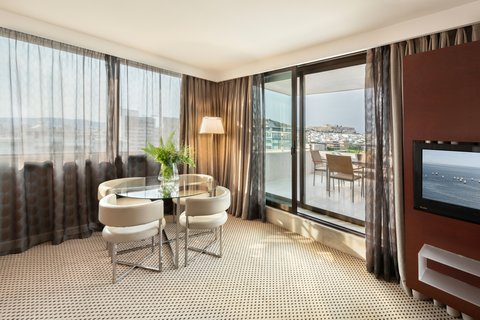 A warm dining space with the Acropolis on the backdrop