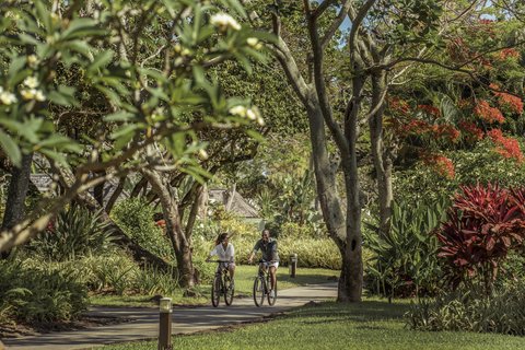 Couple Cycling In Resort