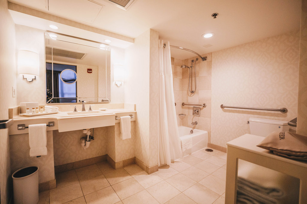 ADA Mobility Accessible Bathroom with Tub and grab bars.