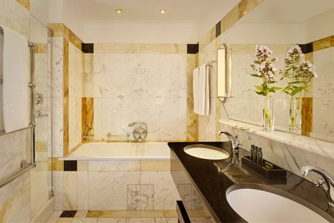 Luxurious marble sinks equipped with amenities