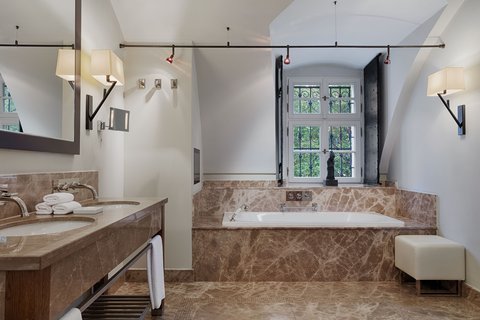 Monastery Suite - Bathroom with bathtub and shower