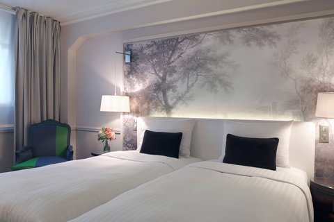 Habitación Deluxe con dos camas sencillas y vista al jardín