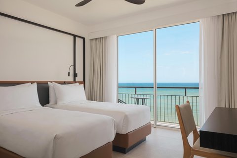 Habitación Deluxe con dos camas individuales y vista al mar
