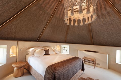 Bedroom with an impressive, coned roof.