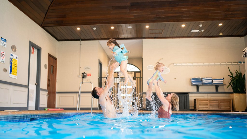 Family swimming in the indoor heated pool