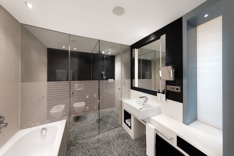 Refined luxury awaits in the bathroom of our King Premium Room
