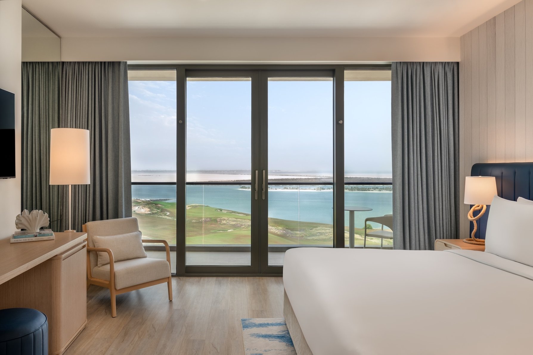 Crowne Plaza ABU DHABI - YAS ISLAND by IHG Room Type - 1 Bedroom Suite Sea View Balcony Living Theme Park