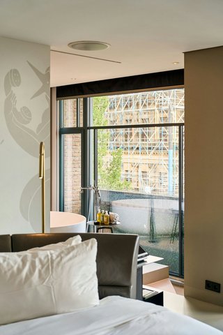 Bedside view, bathroom glimpse