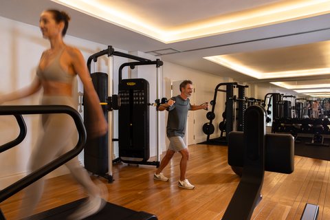 METT Barcelona Hotel Valmont Spa Gym Wide Shot Couple Wroking Out